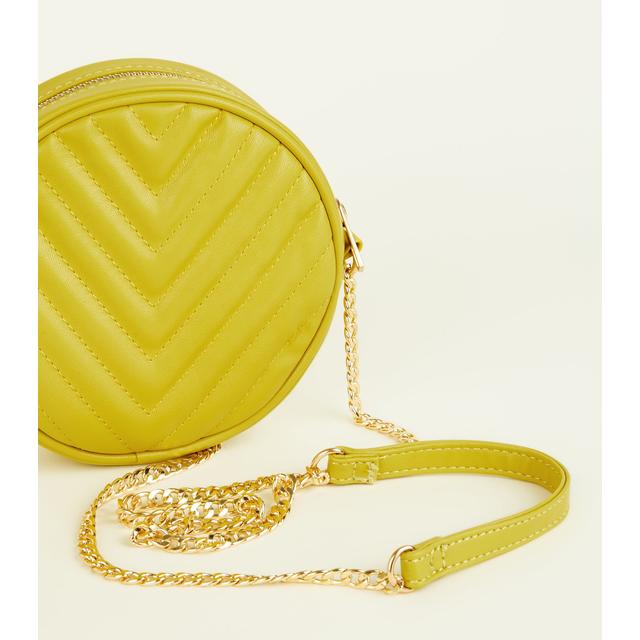 yellow round crossbody bag