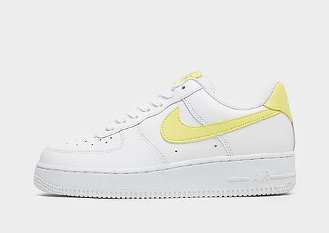 white nike air force with yellow tick
