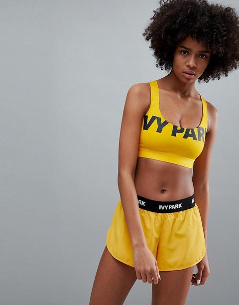 Ivy Park Active Logo Bra In Orange - Old Gold