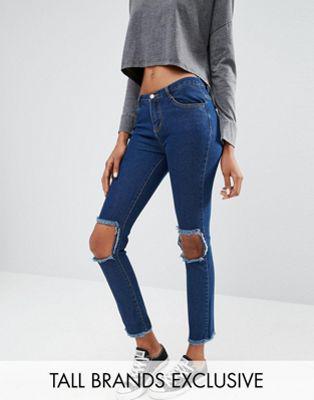 Jeans Skinny Con Strappi Sulle Ginocchia