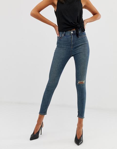 Asos Design Ridley High Waisted Skinny Jeans In Aged Vintage Mid Wash With Ripped Knee