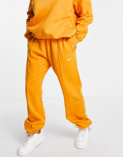 Nike Mini Swoosh Oversized Joggers In Orange-yellow