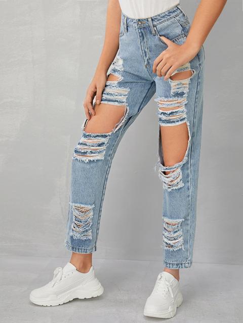 Jeans Slavati Con Strappati