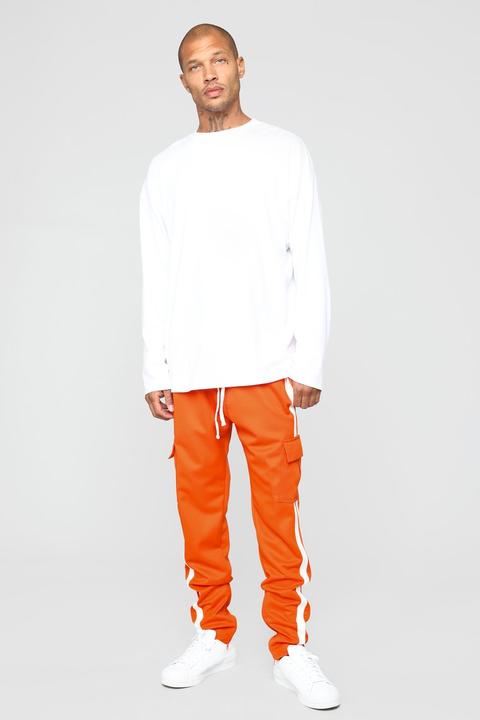 Orange and sale white track pants