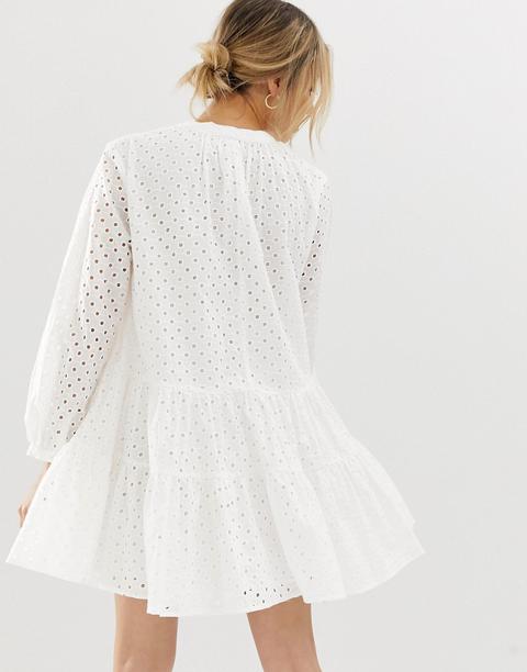 tiered trapeze mini dress in broderie