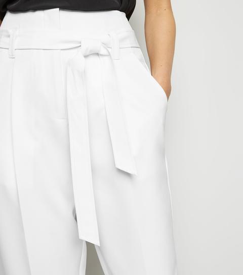 white high waisted tapered trousers
