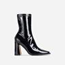 Nessie Flared Block Heel Ankle Sock Boots In Black Patent