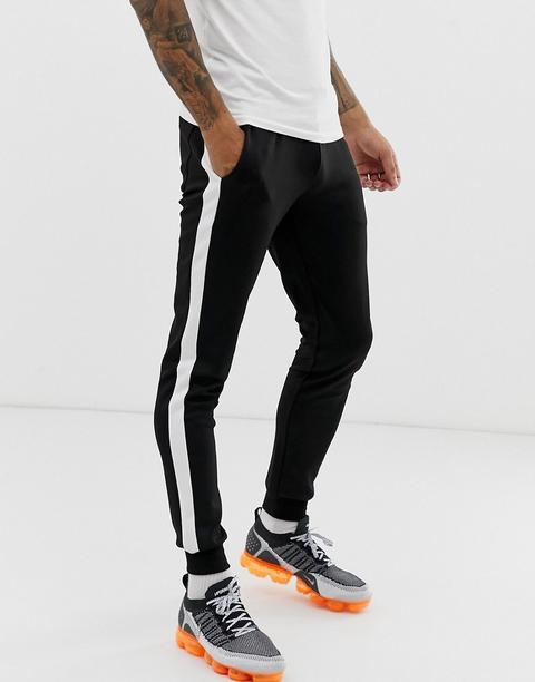 Asos Design - Superschmale Jogginghose Aus Polyestertrikotstoff Mit Seitenstreifen In Schwarz - Schwarz