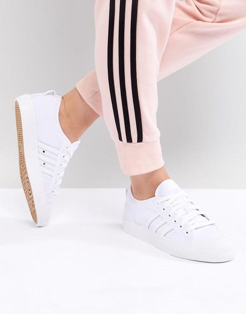 white adidas canvas trainers