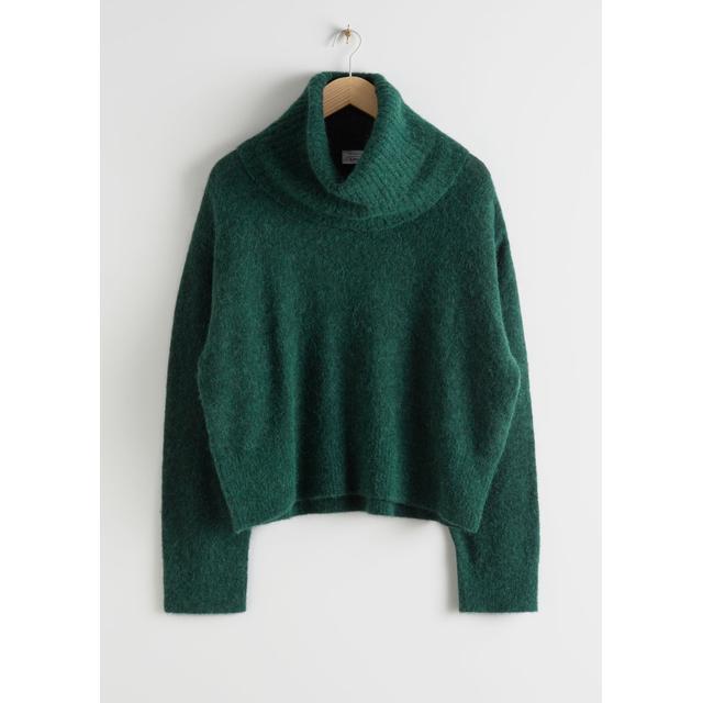 green turtleneck sweater