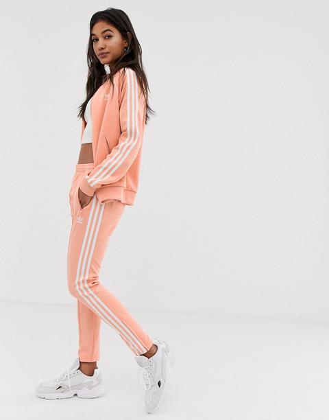 adidas originals three stripe cigarette pants in orange