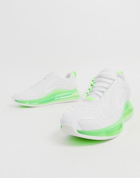 green and white nike trainers