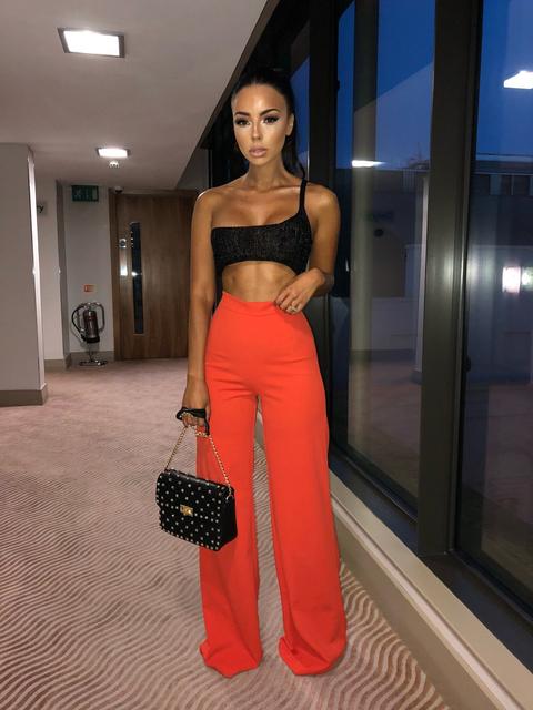 orange high waisted trousers