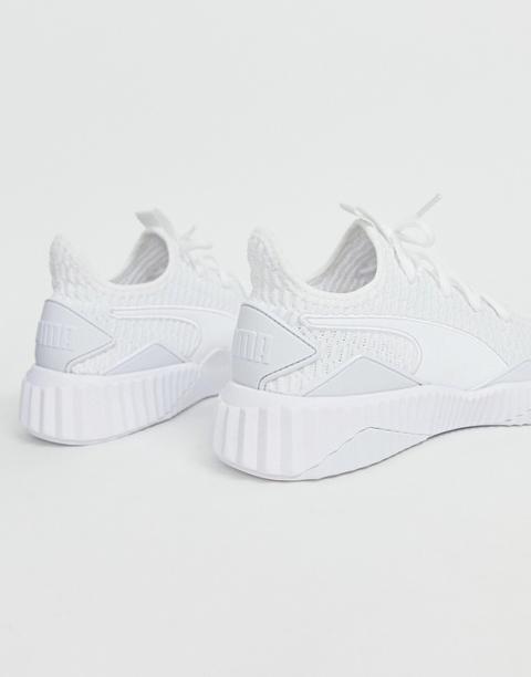 Puma Defy Trainers In White from ASOS 