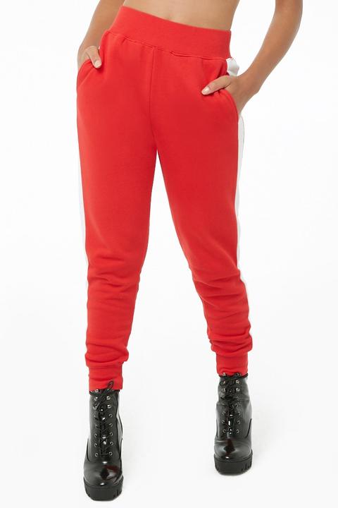 red joggers with white stripe