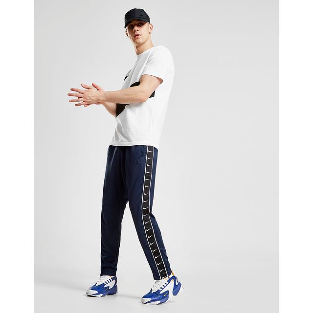 nike tape track pants blue