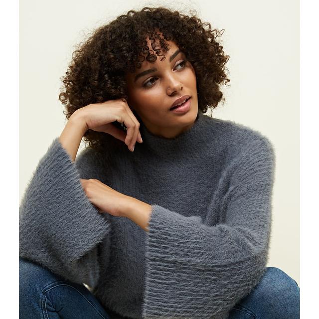 grey fluffy jumper