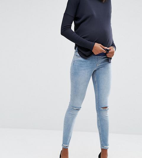 Asos Maternity - Lisbon - Jeans Skinny Lavaggio Stone Wash Shelby Chiaro Con Strappi Alle Ginocchia E Fondo Sfilacciato Con Fascia Sotto Il Pancione -