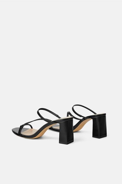 heeled mules with asymmetrical straps