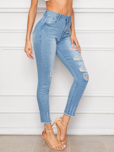 Jeans Strappati Slavati Con Orlo A Grezzo