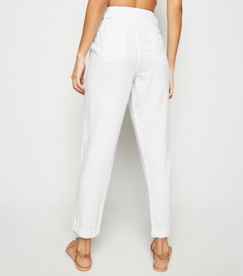 tapered white linen trousers