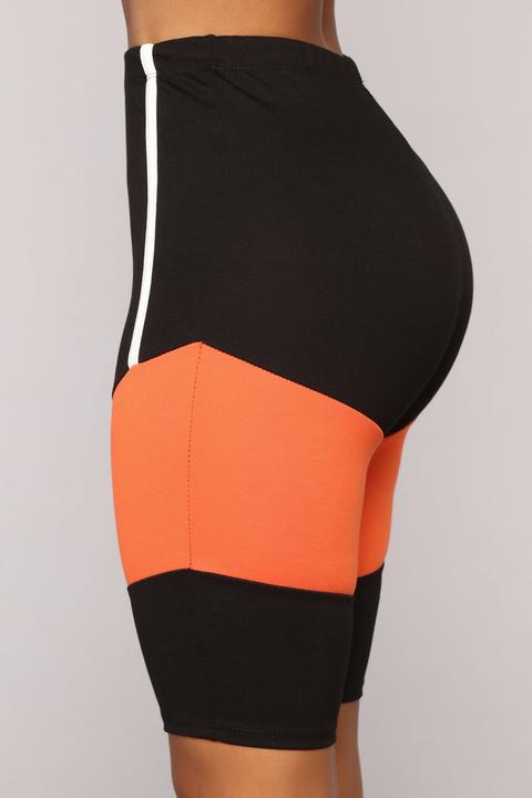 black and orange biker shorts