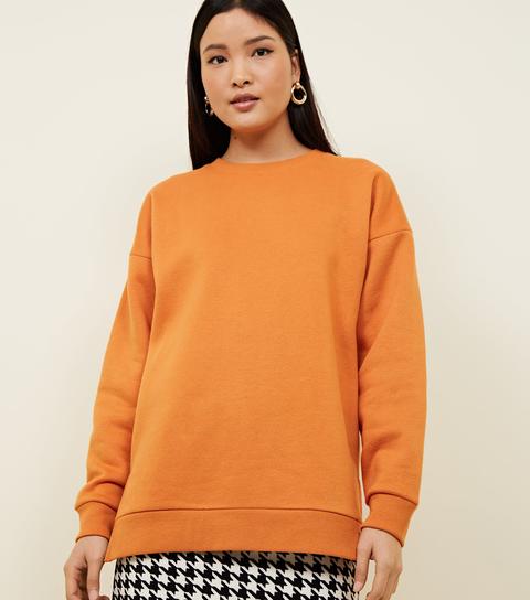 orange oversized sweatshirt