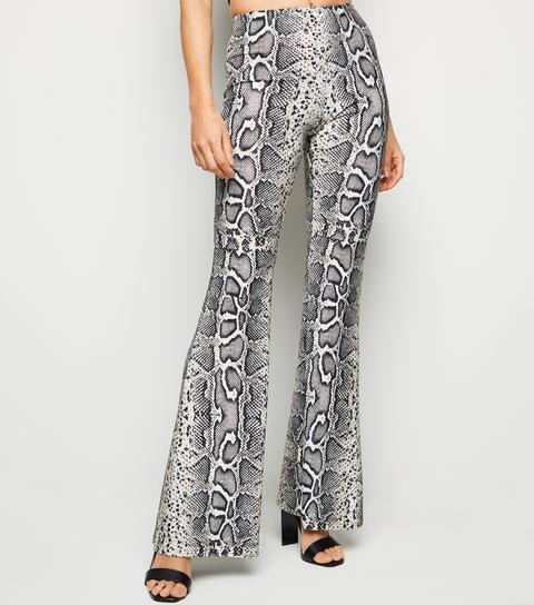 Brown Snake Print Glitter Flared Trousers New Look