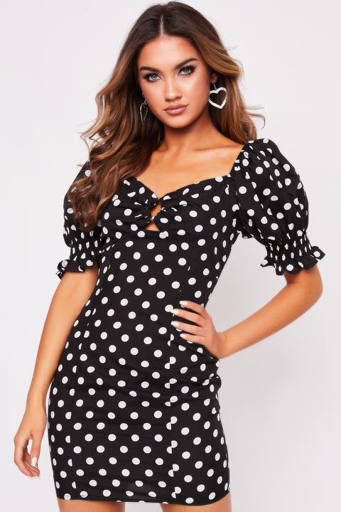 black polka dot dress with puff sleeves