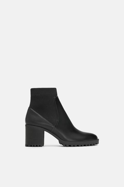 sock style heeled ankle boots with lug soles